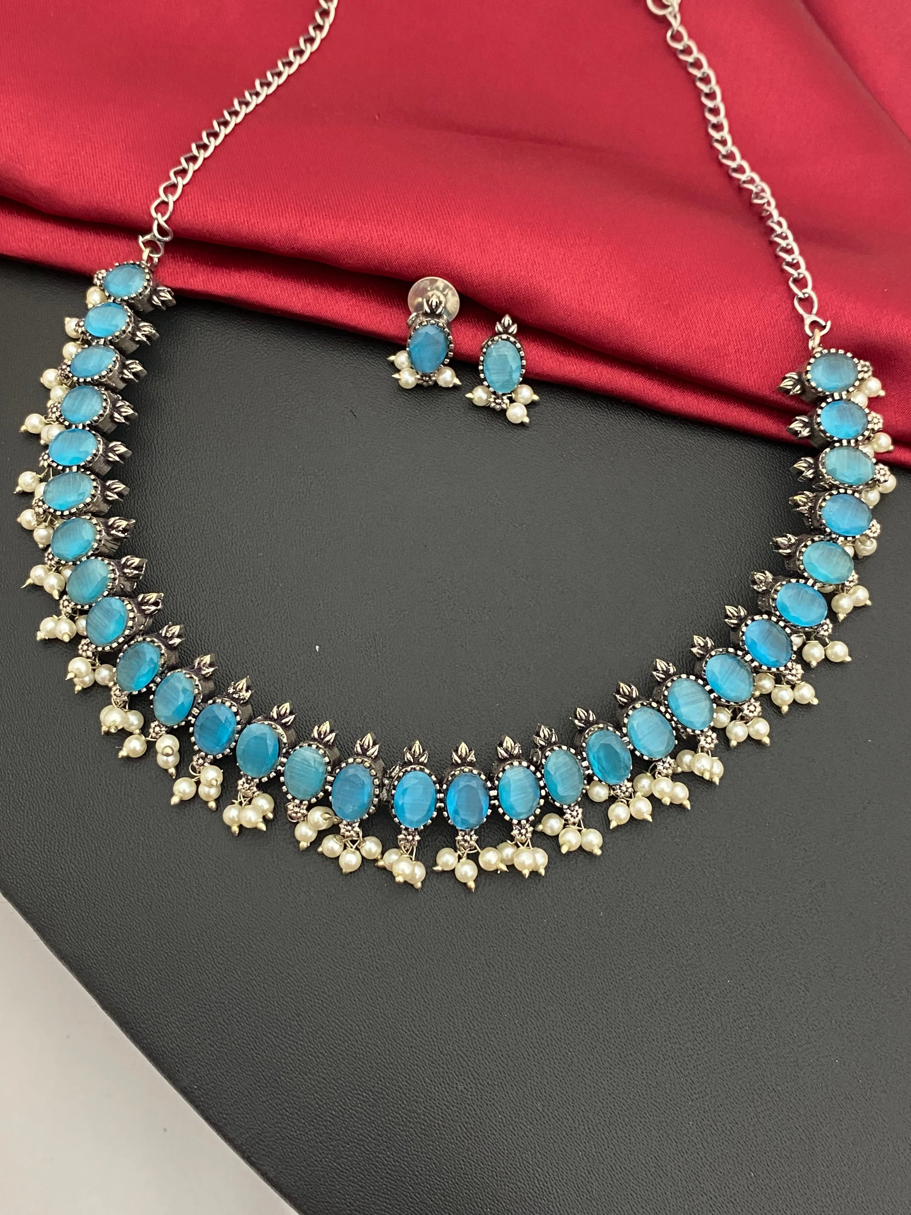 Ravishing Sky Blue Stone Studded German Silver Oxidized Necklace With Earrings