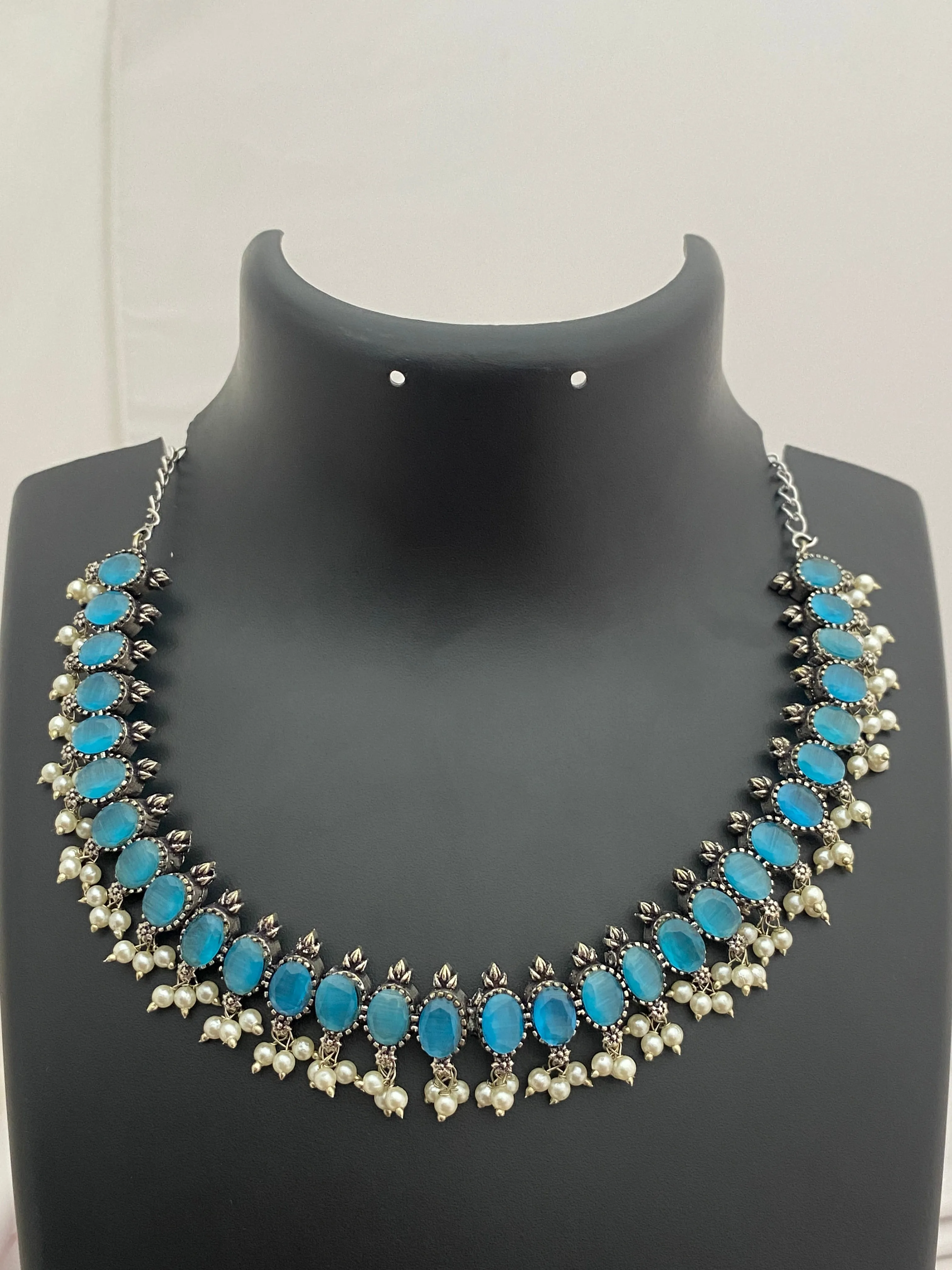 Ravishing Sky Blue Stone Studded German Silver Oxidized Necklace With Earrings